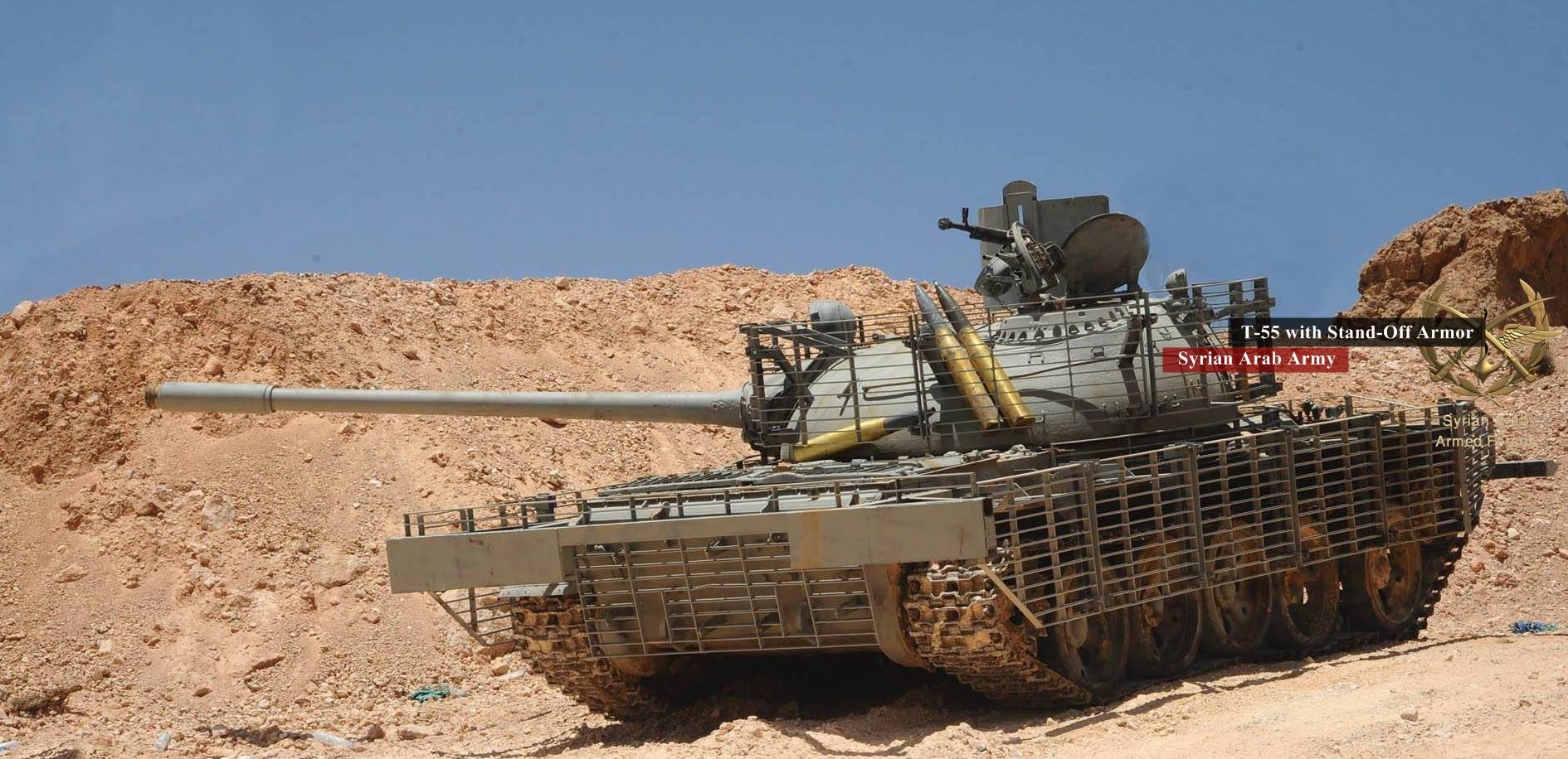 A T-55 fitted with cage armor, similar to the above. A new fender can be seen on the far right of the front of the hull. Additional munitions are clearly stored in the turret cage.