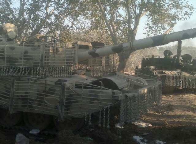 T-72 Mahmia, probably from the same batch as the above. It shows signs of battle damage, or, more likely, careless driving, as it is missing some chains, and the cages and fenders are bent out of shape.